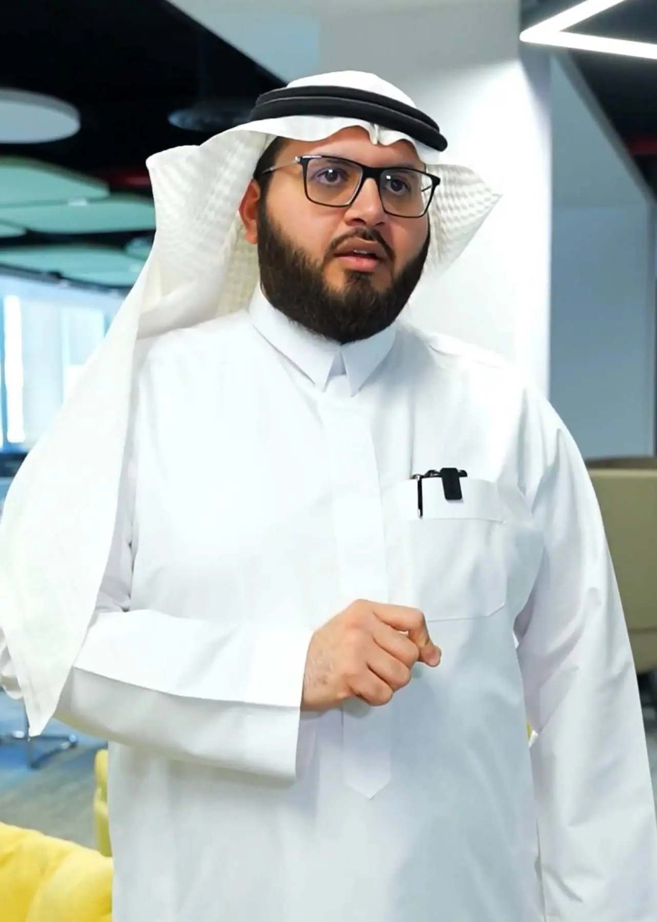 Ahmed Alshareef standing in an exhibition hall